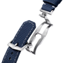 Navy blue woven fabric watch strap with white stitching and silver-tone metal buckle and lugs.