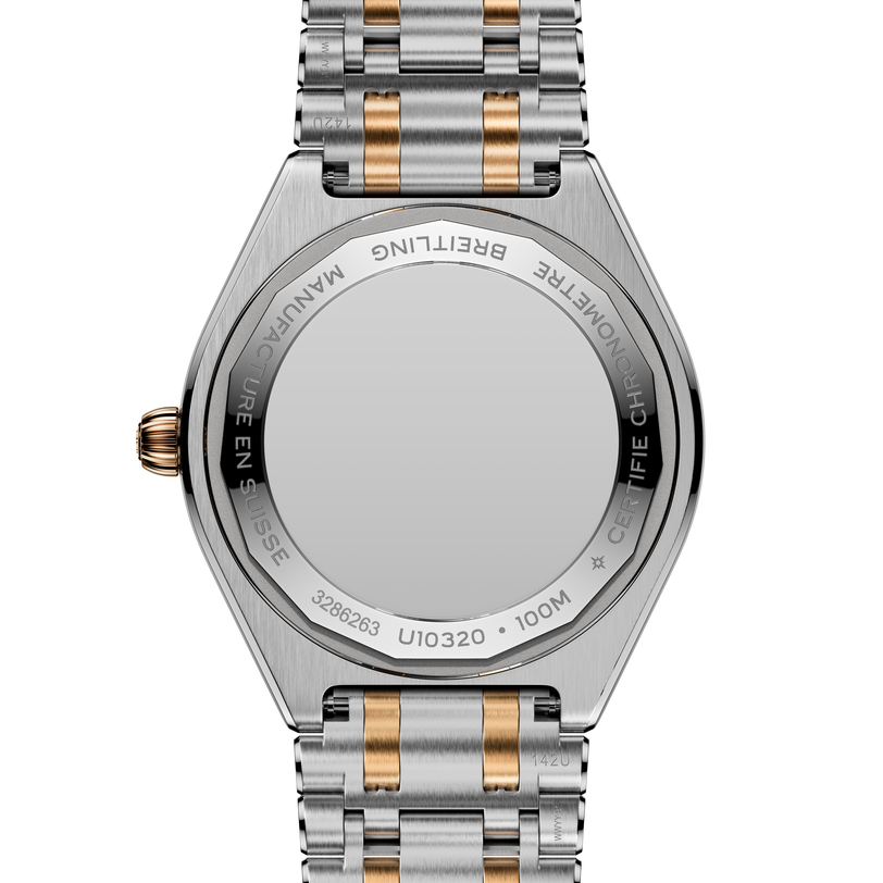 Steel and rose gold two-tone bracelet watch with octagonal case and engraved caseback, shown from rear view.