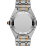 Steel and rose gold two-tone bracelet watch with octagonal case and engraved caseback, shown from rear view.
