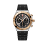 Breitling Chronomat B01 42 chronograph watch with two-tone steel and rose gold case, black dial, and black rubber strap.