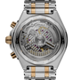 Chronomat B01 42 watch with two-tone steel and gold bracelet, showing exposed movement through transparent caseback with visi