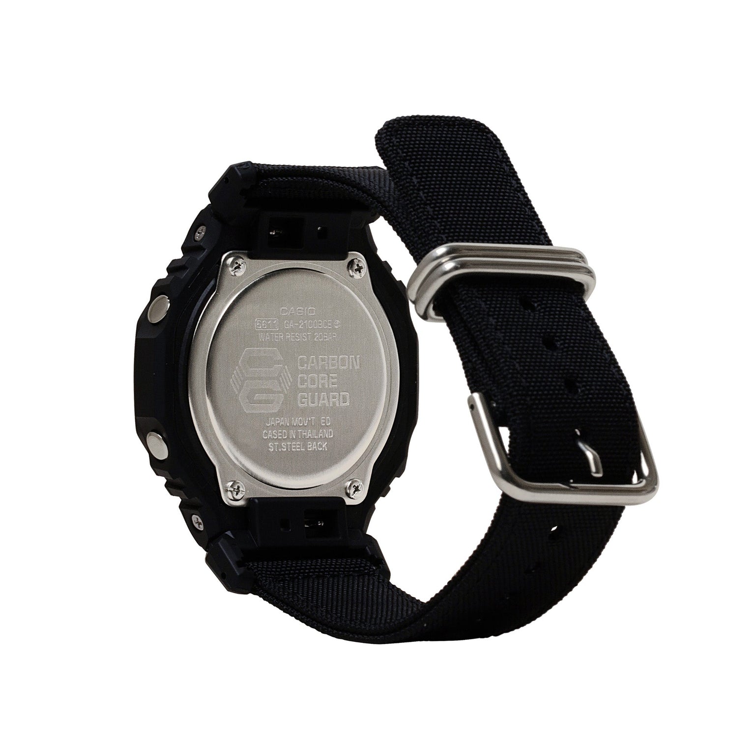 Black resin digital watch with black fabric strap, metal case back, and silver-tone hardware shown from rear angle.