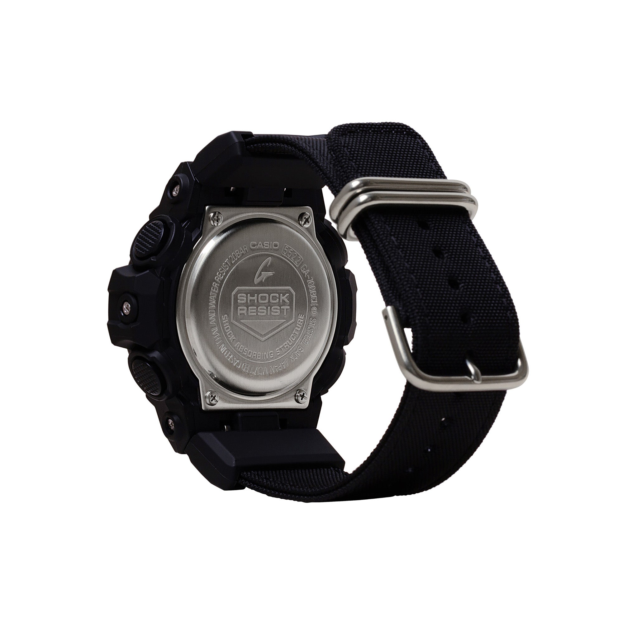 Black digital watch with silver metal case back, black resin band, and silver buckle closure.
