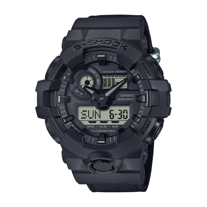 Black G-Shock watch with analog hands, digital display, resin band, and shock-resistant case.