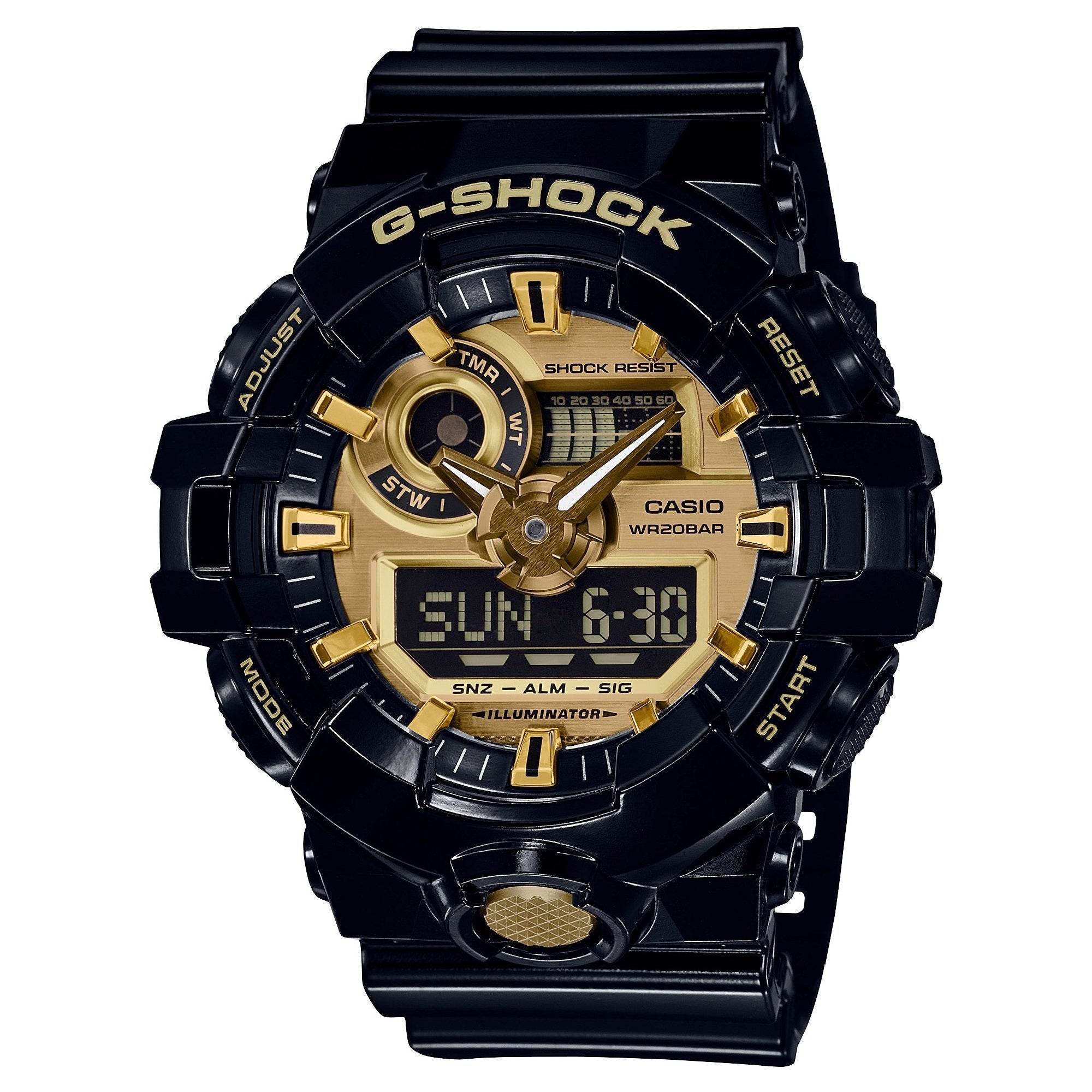 Black G-Shock digital watch with gold-tone dial, analog hands, LCD display, and resin band.
