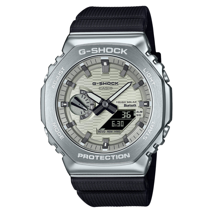 G-Shock watch with silver stainless steel case, black resin band, analog dial with digital display showing time and features.