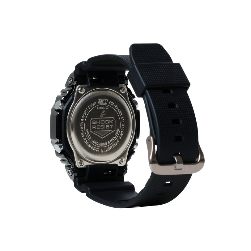 Black digital watch with stainless steel case, resin band, and metal buckle displayed from side angle.