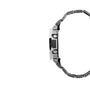 Digital watch with stainless steel and black resin band, rectangular face with silver case, shown from side view.