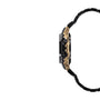 Black digital watch with gold-tone and black stainless steel case, black band with segmented links, and two black subdials on