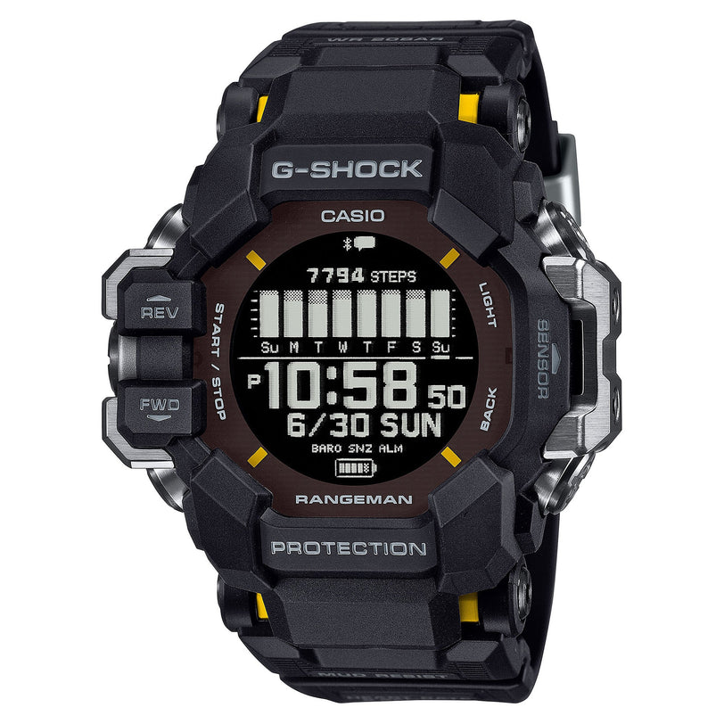 Black Casio G-Shock Rangeman digital watch with brown dial, yellow accents, and resin band displaying time and step counter.
