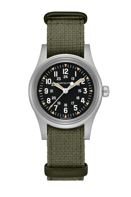 Watch with green strap and black dial on a white background