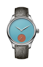 Silver watch with light blue dial, small seconds subdial in rust orange, and charcoal textured leather strap.