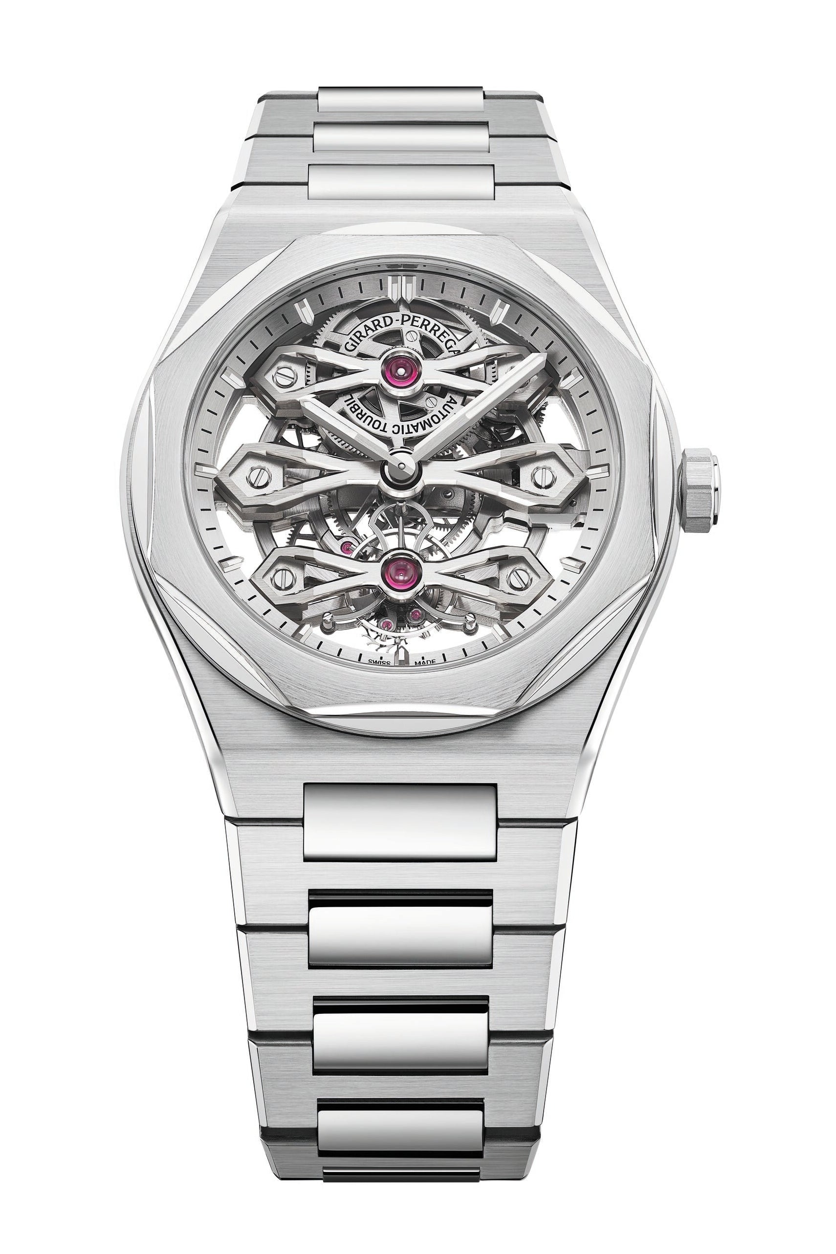 The Girard-Perregaux Laureato Three Gold Bridges is a luxury silver wristwatch featuring a stainless steel bracelet and an openwork skeleton dial that showcases intricate gears, components, and a tourbillon. The brand’s name appears at the top of the dial.