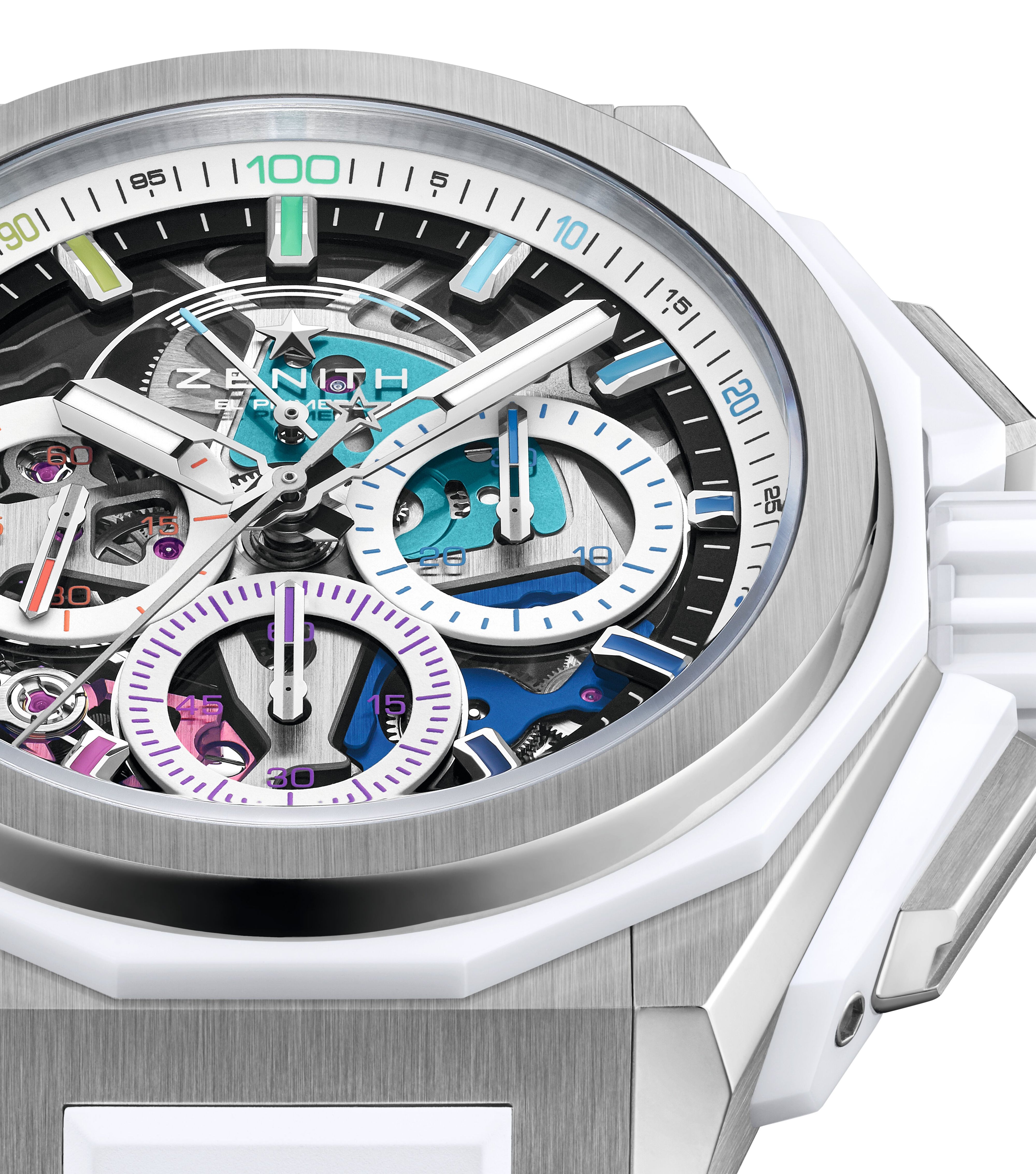 Close-up of the Zenith Defy Extreme Chroma, a luxury titanium watch with a white ceramic bezel, visible gears, and vibrant purple, blue, and turquoise chronograph subdials. Features the El Primero 9004 movement and a partially skeletonized dial.