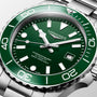 Longines watch with green dial and silver case on a light gray background