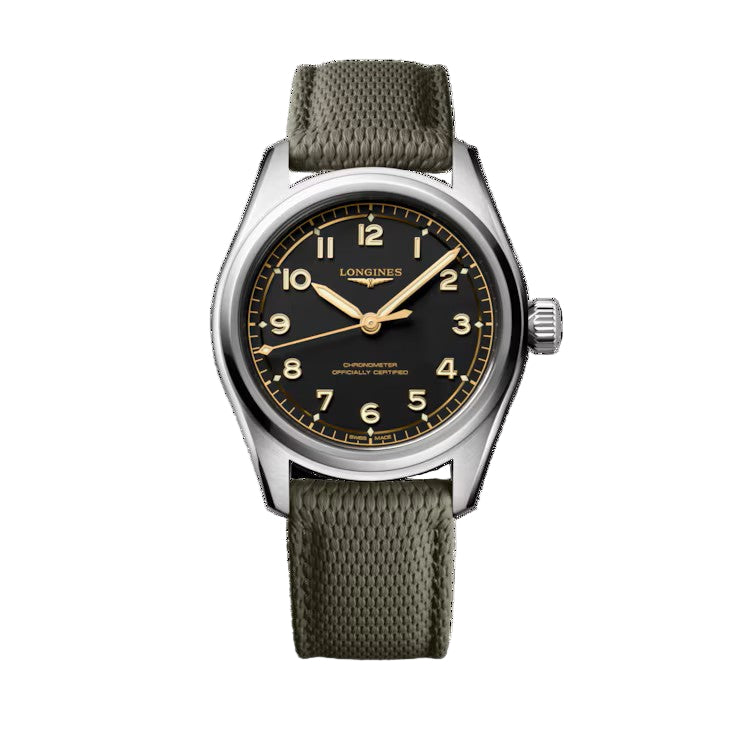 The Longines Spirit Pilot wristwatch showcases a black dial with Arabic numerals, luminous hands, a stainless steel case, and an olive green textured strap, elegantly displayed against a white background.