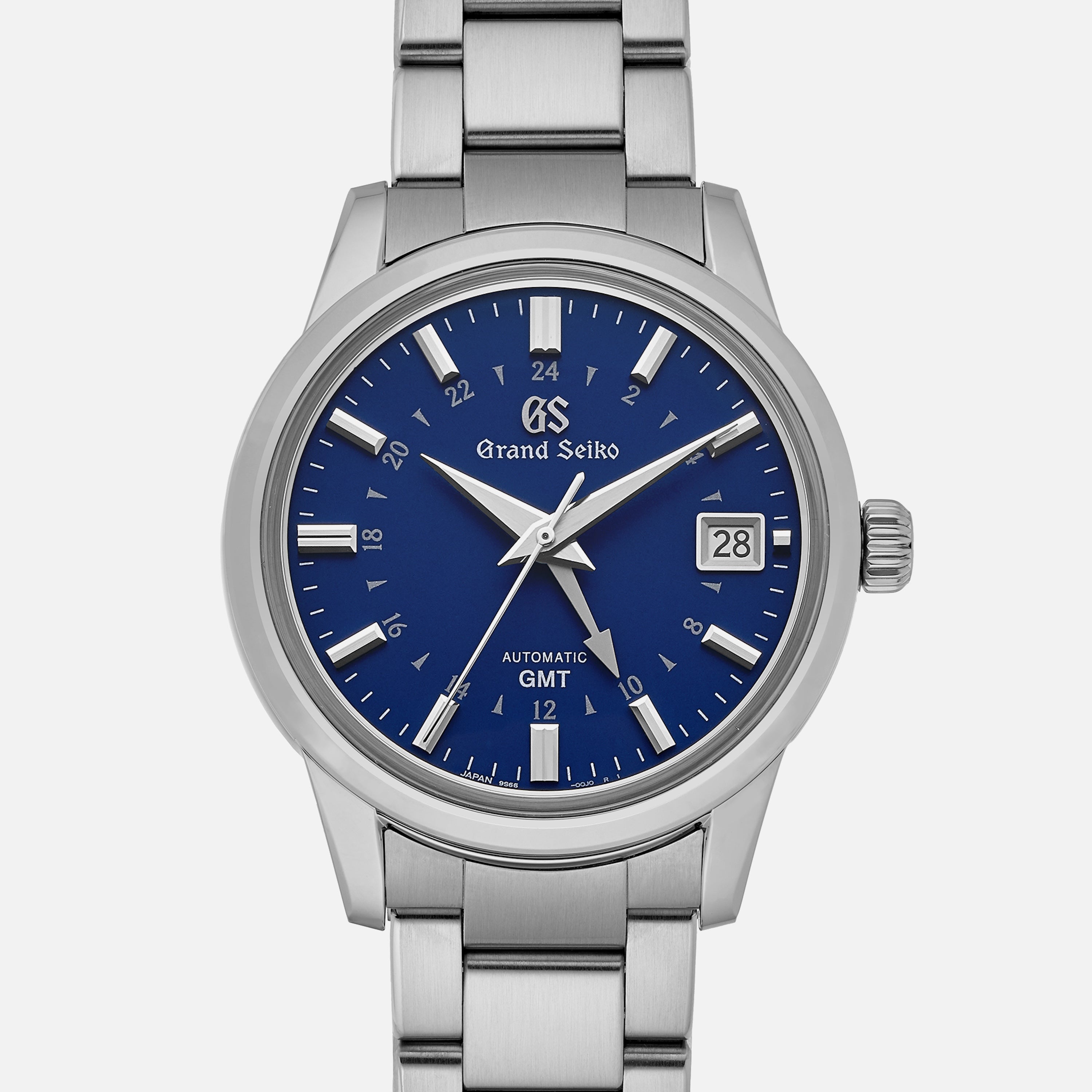 The Grand Seiko Automatic GMT SBGM239 Limited Edition For HODINKEE features a blue dial with silver markers and hands, date at 3 o’clock, GMT function, 24-hour inner ring, stainless steel case and bracelet. Available exclusively on HODINKEE.
