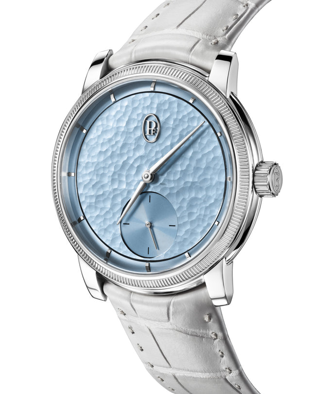 Watch with a light blue face and white leather strap on a white background