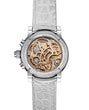 Luxury watch with mechanical components and white strap on a white background