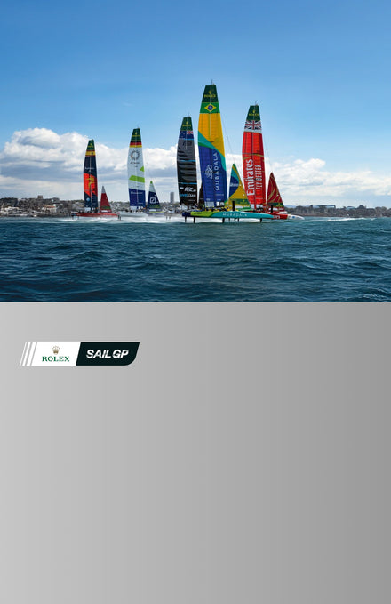 Sailboats with colorful sails racing on the water, featuring the Rolex Sail GP logo.