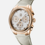 The Parmigiani Fleurier TONDA PF Sport is a gold chronograph wristwatch featuring a white textured dial and beige fabric strap, shown against a white background.