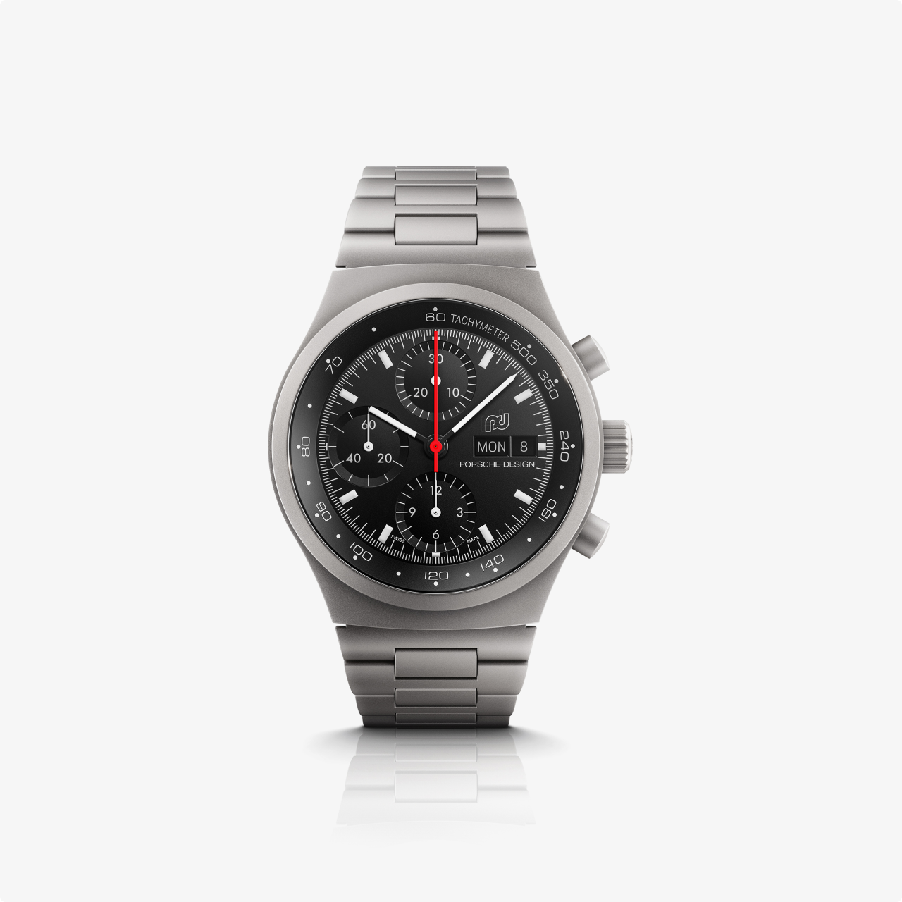 The Porsche Design Chronograph 1 1975 Limited Edition is a stainless steel chronograph watch with a black dial and three subdials, shown on a white background.