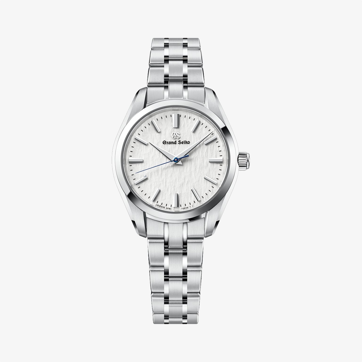 Silver watch with a white face on a light gray background