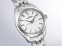 Silver Grand Seiko watch on a light gray background