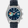 The TAG Heuer Limited Edition Carrera Skipper For HODINKEE features a blue dial, date window, and black perforated leather strap.