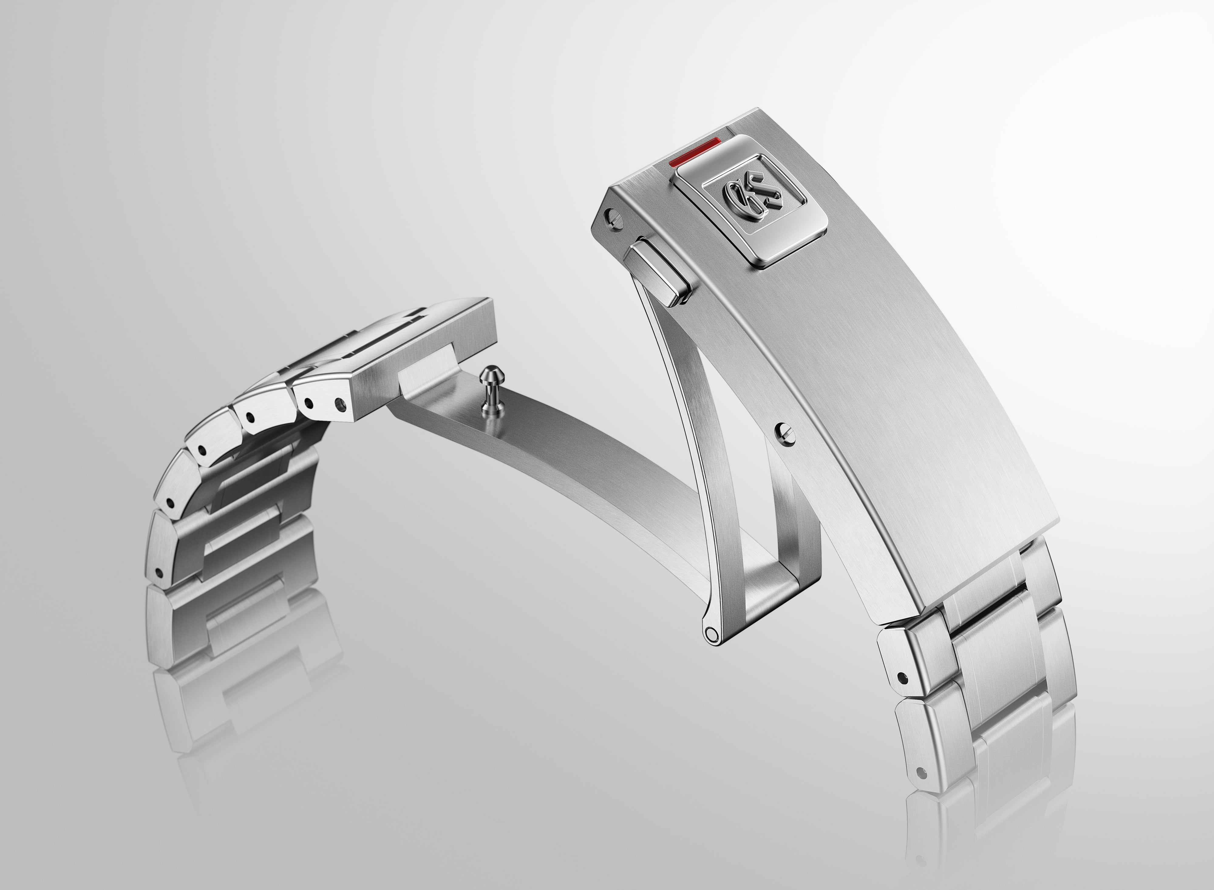 Silver stainless steel dive watch with rectangular case, metal bracelet, and red accent on buckle clasp.
