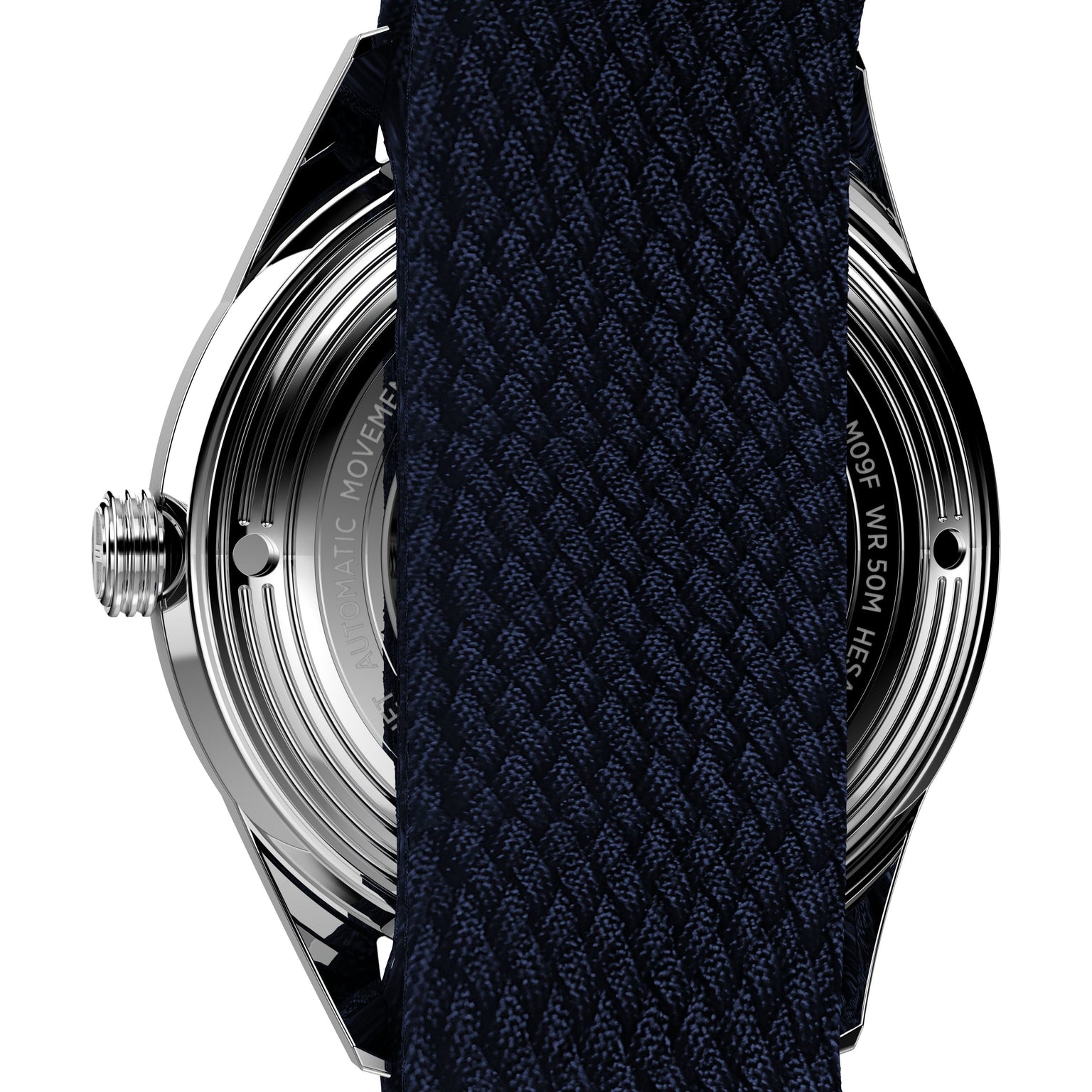 Close-up of the back of the Timex Marlin® Jet Automatic watch, with a dark textured fabric strap partially covering the metal case and engraved text.