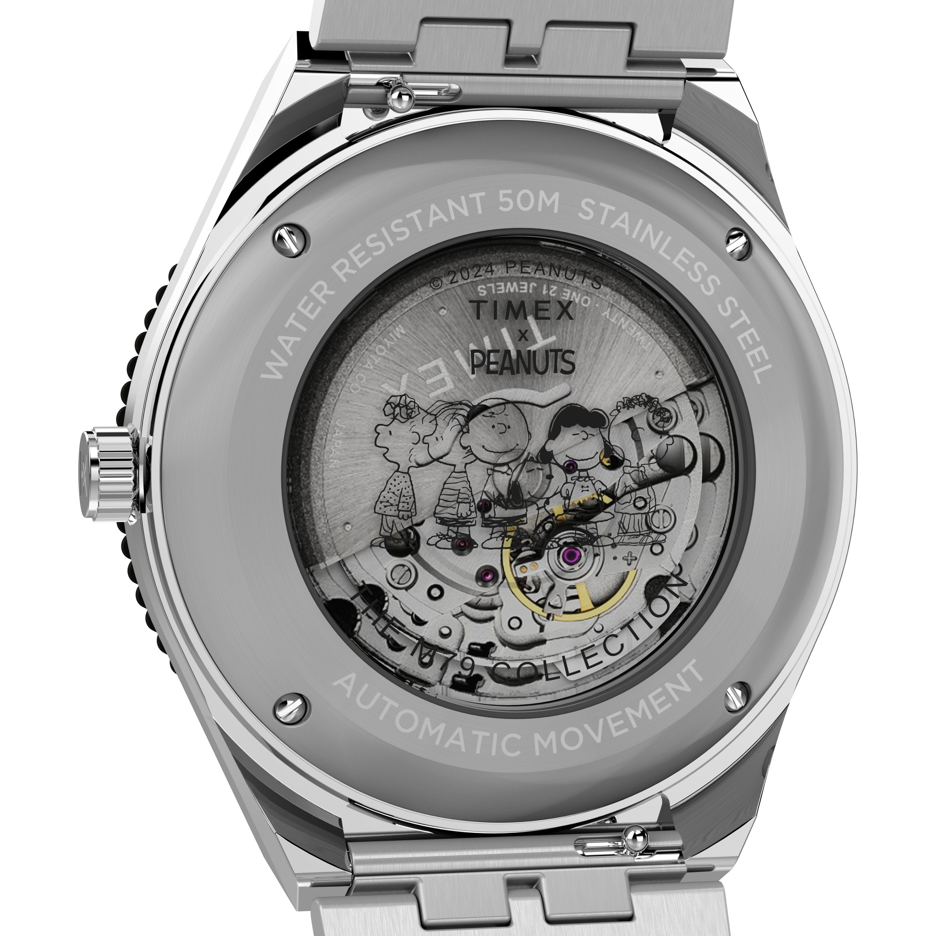 Close-up of the M79 Automatic x Peanuts watch by Timex, featuring Peanuts characters on the transparent case back that reveals the automatic movement. The case also displays water resistance info, materials, and a stainless-steel bracelet.