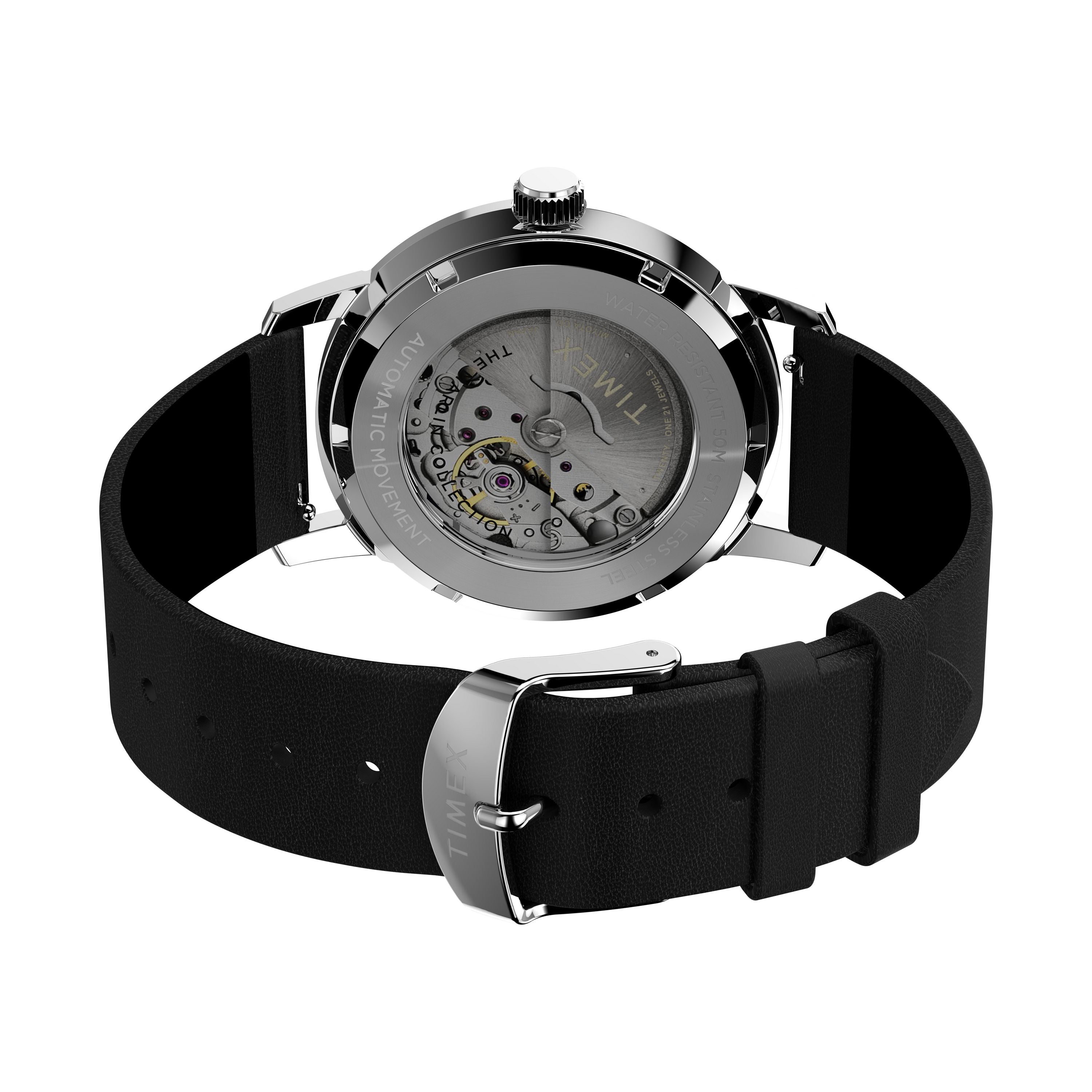 A close-up of the Timex Marlin® Automatic reveals its 21-jewel Japanese automatic movement, black eco-friendly leather strap with a silver Timex-engraved buckle, and a stainless steel case with visible gears through the transparent back.