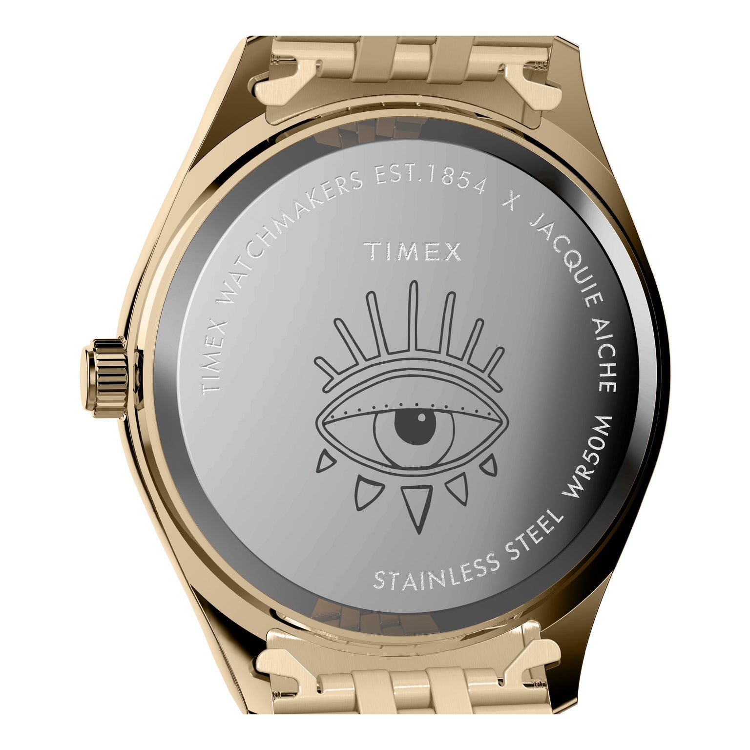 The Timex x Jacquie Aiche wristwatch features a gold case back engraved with an eye illustration, branding, and WR50M—a true Guiding Light timepiece from Timex.