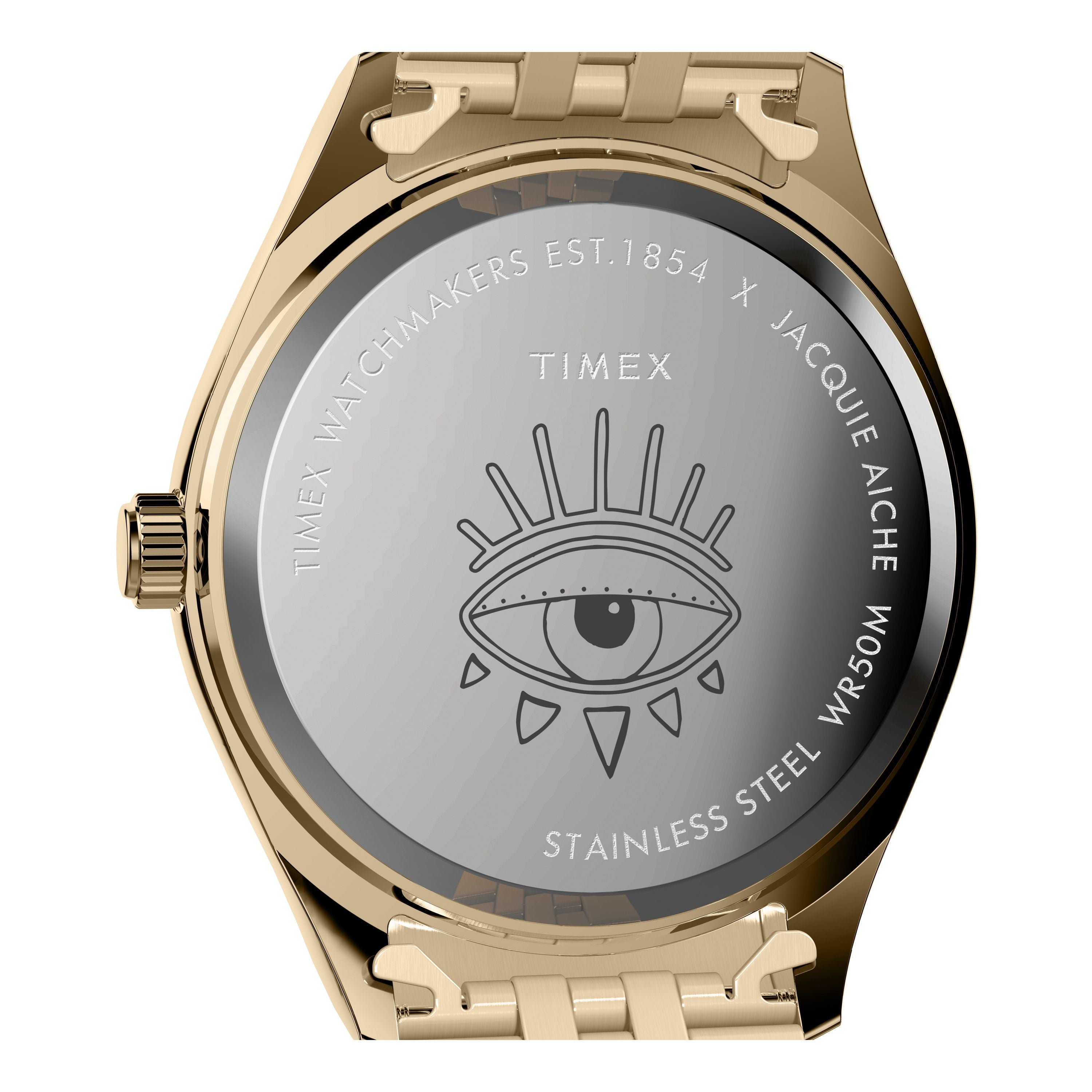 The Timex x Jacquie Aiche wristwatch features a gold case back engraved with an eye illustration, branding, and WR50M—a true Guiding Light timepiece from Timex.