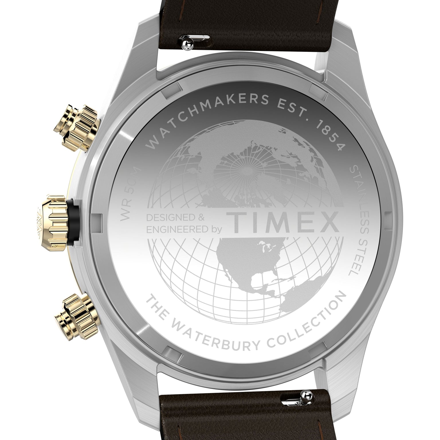Back of the Timex Waterbury Heritage Chronograph shows engravings like a world map, “Watchmakers Est. 1854,” and “The Waterbury Collection,” plus gold/silver pushers on the stainless steel case and a brown leather strap.