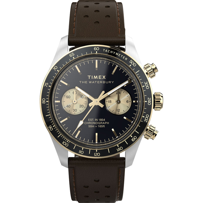 The Timex Waterbury Heritage Chronograph features a black dial with gold accents, two subdials, a tachymeter bezel, stainless-steel case, brown perforated leather strap, and two gold push buttons on the right side.