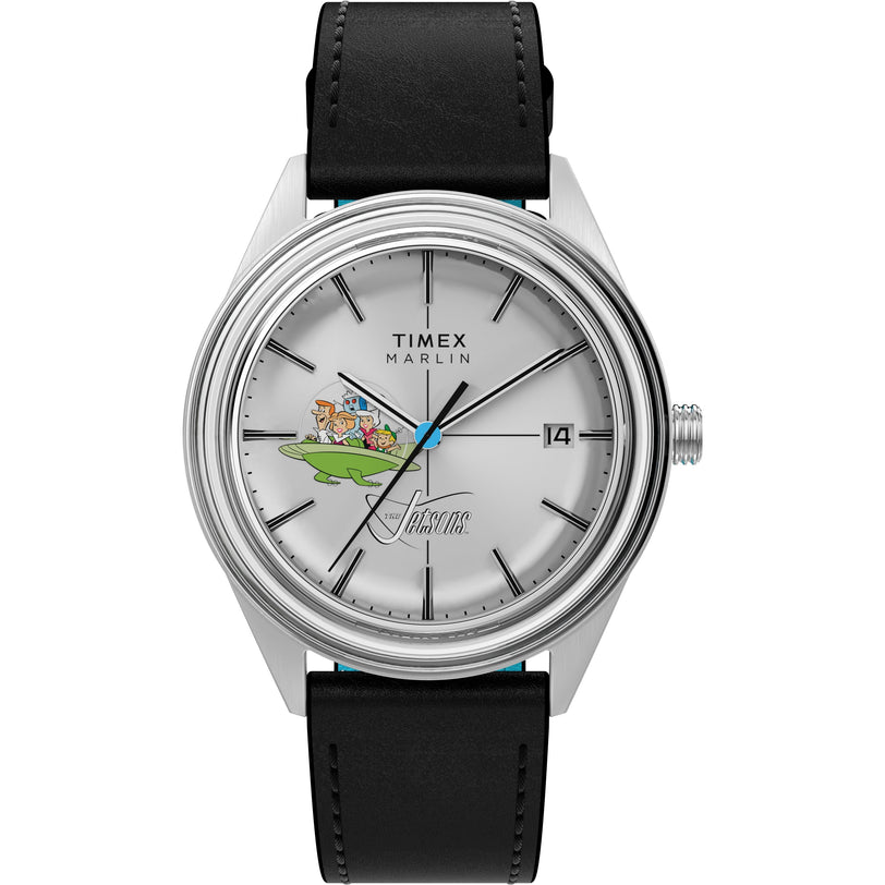 The Timex Marlin Jet Automatic x The Jetsons is a retro-futuristic watch with a silver case, black leather strap, and features the Jetsons family in their spaceship on the dial, with black hour markers and a date window at 3 o’clock.