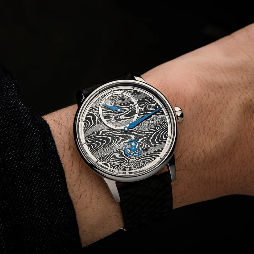 Luxury watch with intricate design on a wrist against a dark background