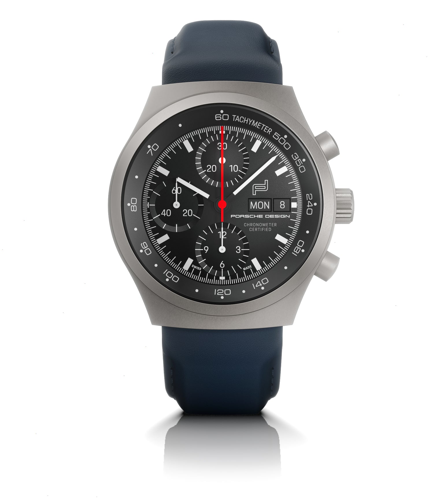 Titanium chronograph watch with black dial, tachymeter bezel, date window, and dark blue rubber strap.