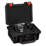 Black rugged case with red latches open to display steel watch with blue dial and black cylindrical object inside.