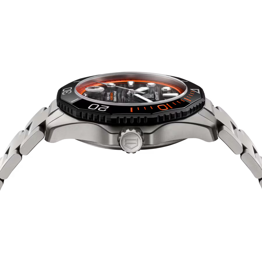Steel sports watch with orange and black bezel, black dial, and metal bracelet shown from the side.