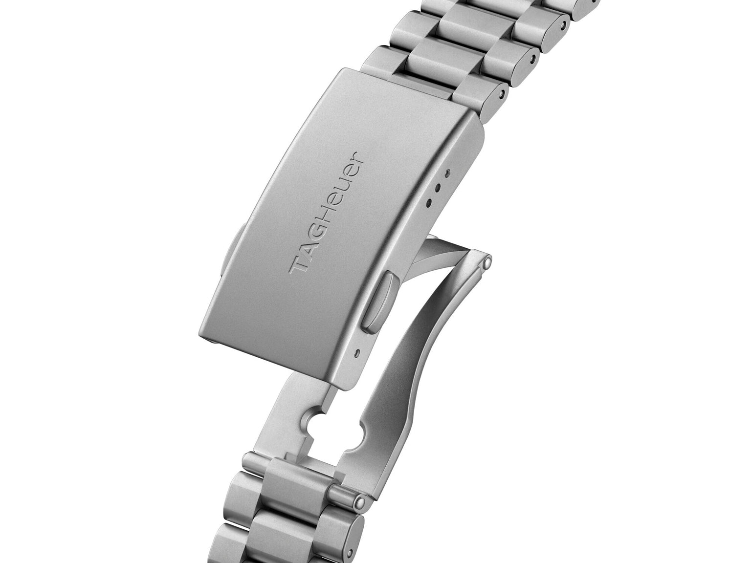 Silver metal watch bracelet with rectangular clasp buckle and TAG Heuer branding visible.