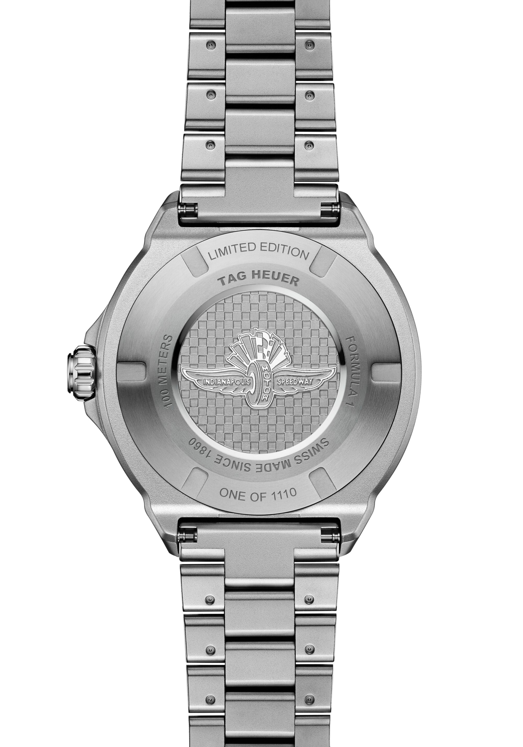 Silver stainless steel watch with linked bracelet, displaying Indy 500 wings logo on caseback, marked "Limited Edition" and "