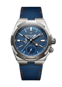 Stainless steel watch with blue dial, dual time zone display, orange accents, and blue textile strap with orange stitching.