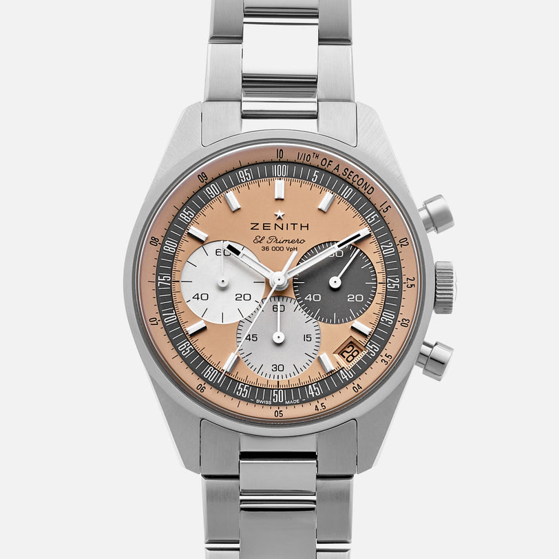 The Zenith Chronomaster Original Limited Edition For Hodinkee is a stainless steel chronograph watch with a pink bezel, three subdials, and a date window, highlighting classic design on a white background.