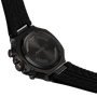 Black Tissot watch with detailed case and strap on a white background
