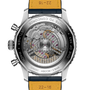 Watch with visible mechanical components and a yellow strap on a white background