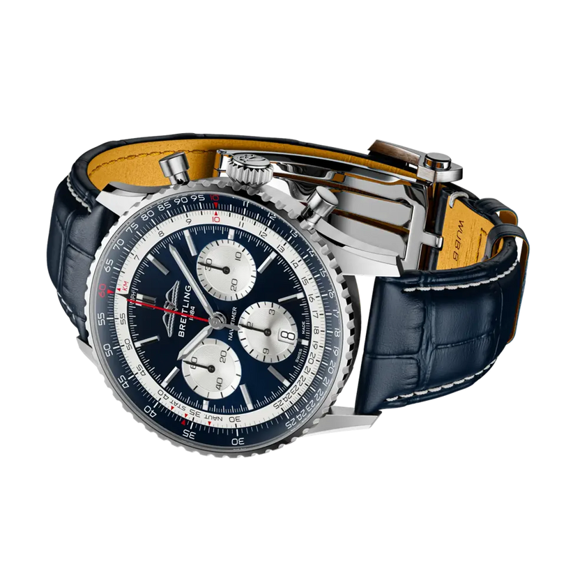Luxury watch with blue face and leather strap on a white background