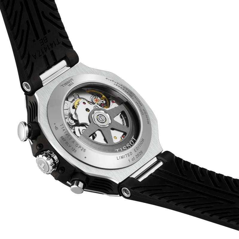 Close-up of a Tissot watch with black strap and visible mechanical components on a white background